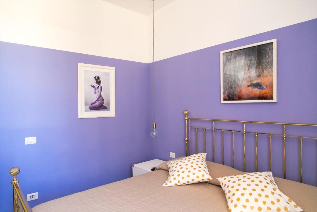Łóżko lub łóżka w pokoju w obiekcie A Casa di Nina Guest House