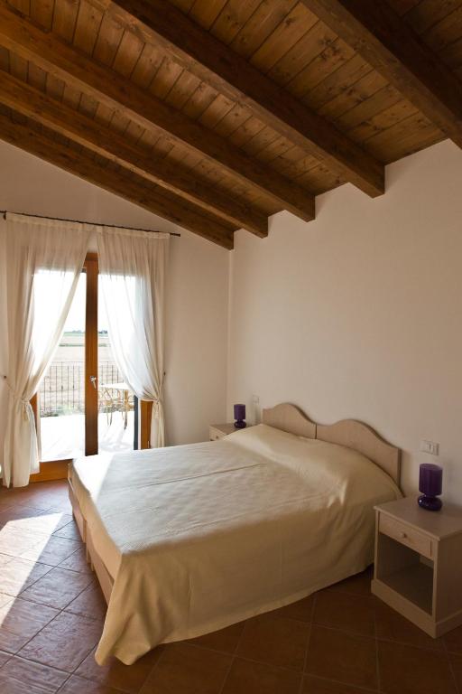 Postel nebo postele na pokoji v ubytování Agriturismo Fiumi Uniti