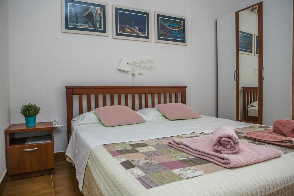 Voodi või voodid majutusasutuse Apartments Filippi toas