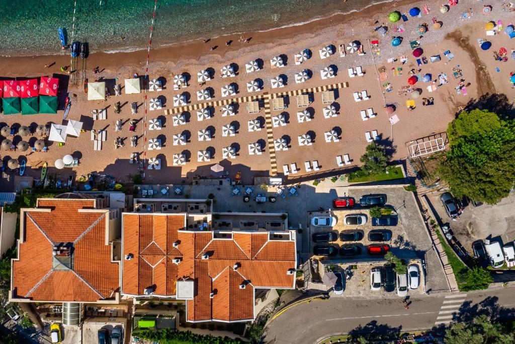 an aerial view of a resort with a beach at Hotel California by Aycon in Sveti Stefan