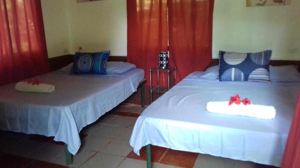 Postel nebo postele na pokoji v ubytování Villa De Los Monos, casitas equipadas en Guanacaste