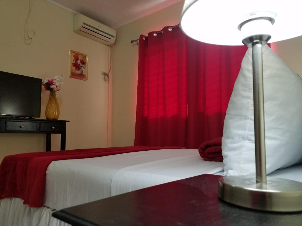 Postel nebo postele na pokoji v ubytování MH Boutique Hotel