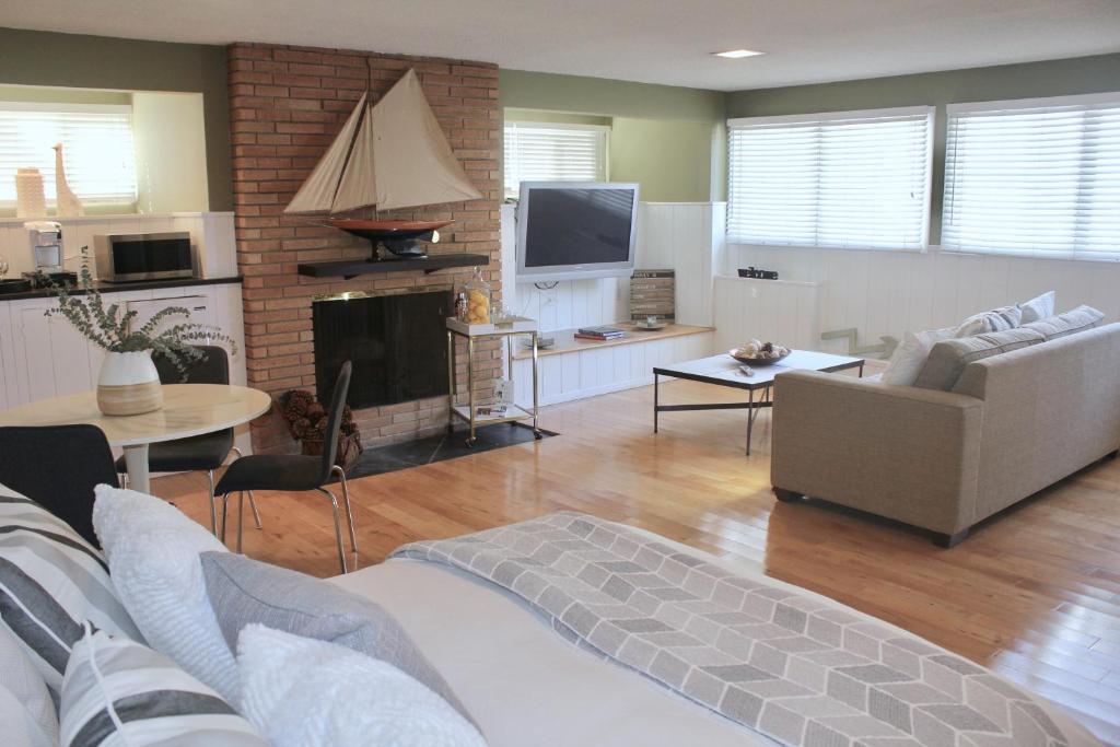 a living room with a couch and a tv at Private Guest Suite in West Los Angeles in Los Angeles