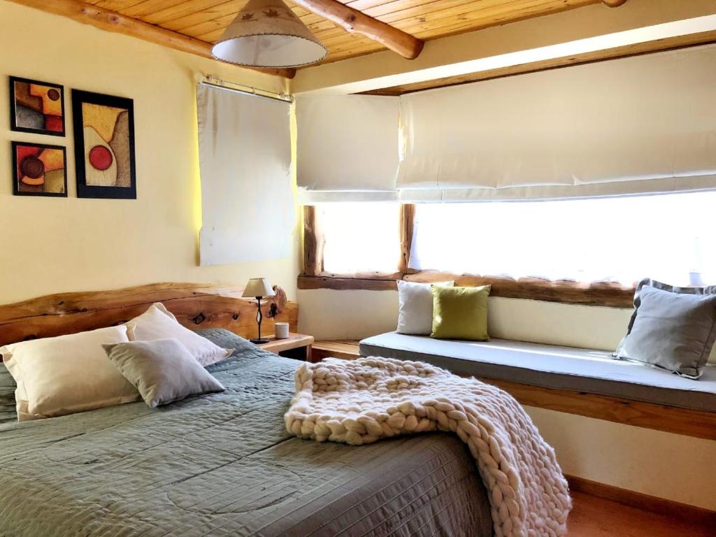 Postel nebo postele na pokoji v ubytování Cabaña Michay Cerro Catedral Bariloche