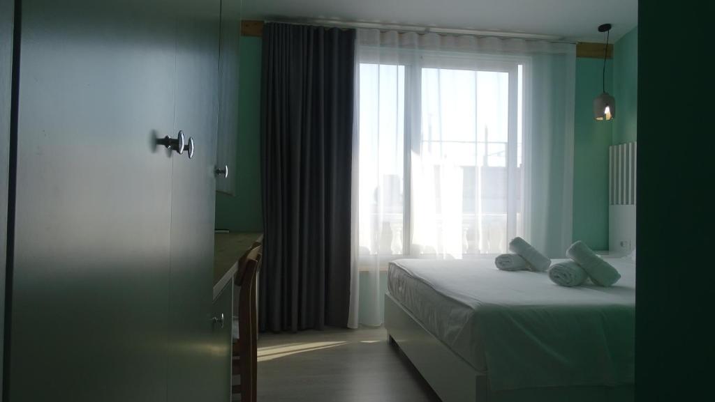 Postel nebo postele na pokoji v ubytování Bistrica Hotel