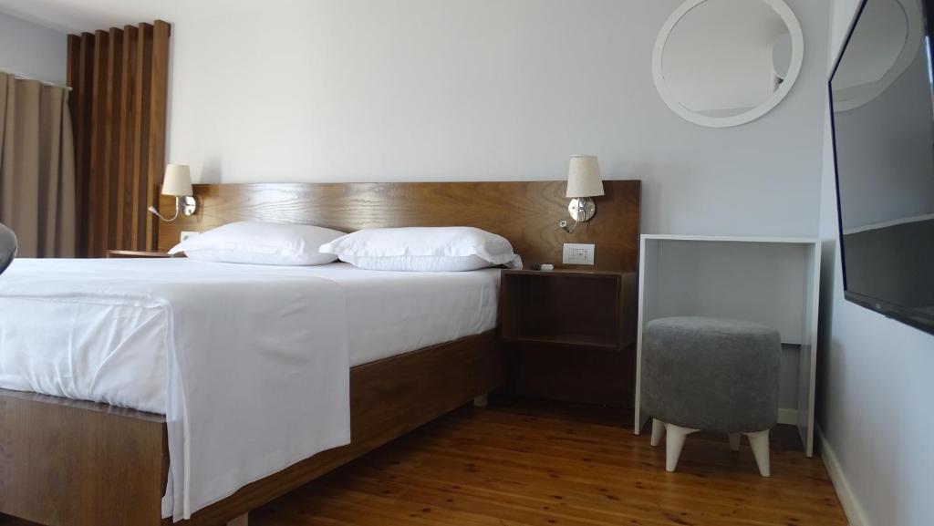 Postel nebo postele na pokoji v ubytování Bistrica Hotel