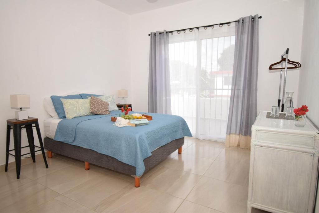 Postel nebo postele na pokoji v ubytování Carlota Guest House