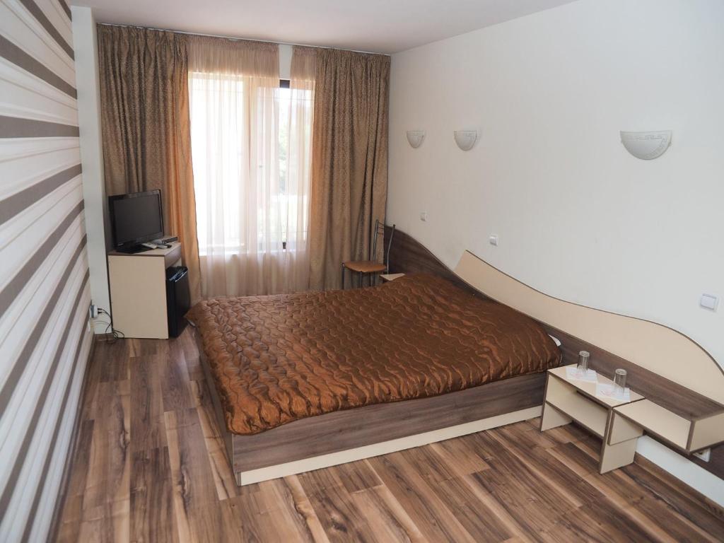 Postel nebo postele na pokoji v ubytování Eos Hotel