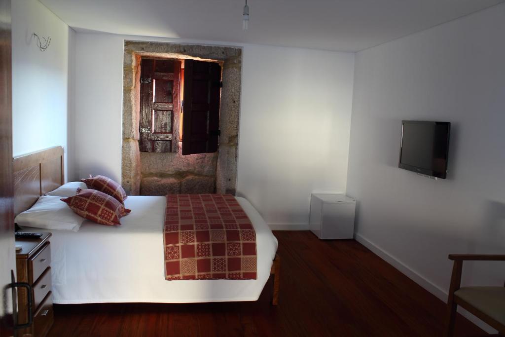 Postel nebo postele na pokoji v ubytování Casa Da Gaiteira