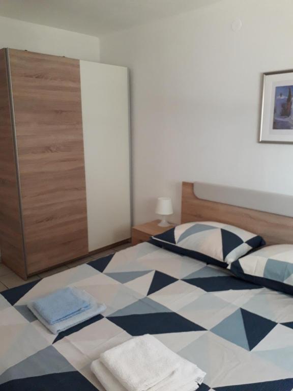 Llit o llits en una habitació de Apartmani Mia