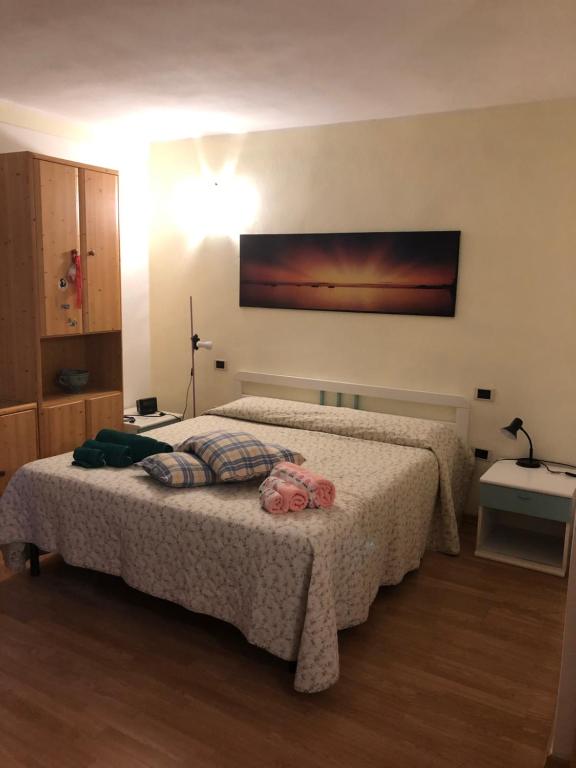 A bed or beds in a room at DaCapo Rooms