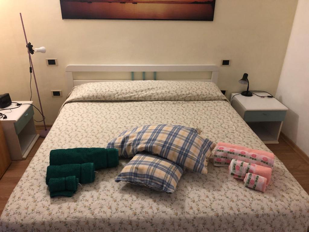 A bed or beds in a room at DaCapo Rooms