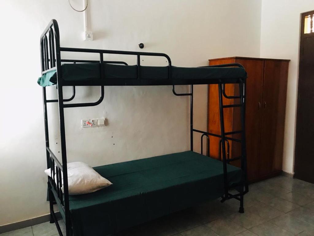 Postel nebo postele na pokoji v ubytování Sea Sands Beach Hostel