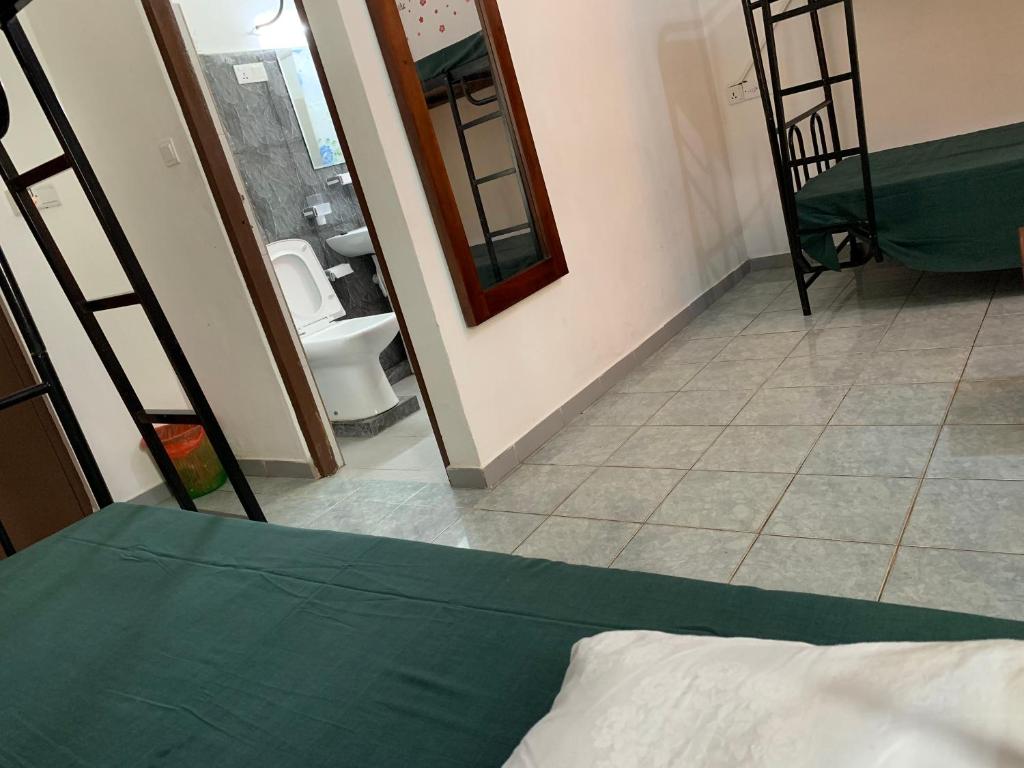 Postel nebo postele na pokoji v ubytování Sea Sands Beach Hostel