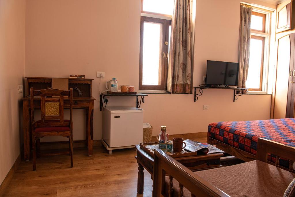 TV o dispositivi per l'intrattenimento presso Hotel Arya Niwas