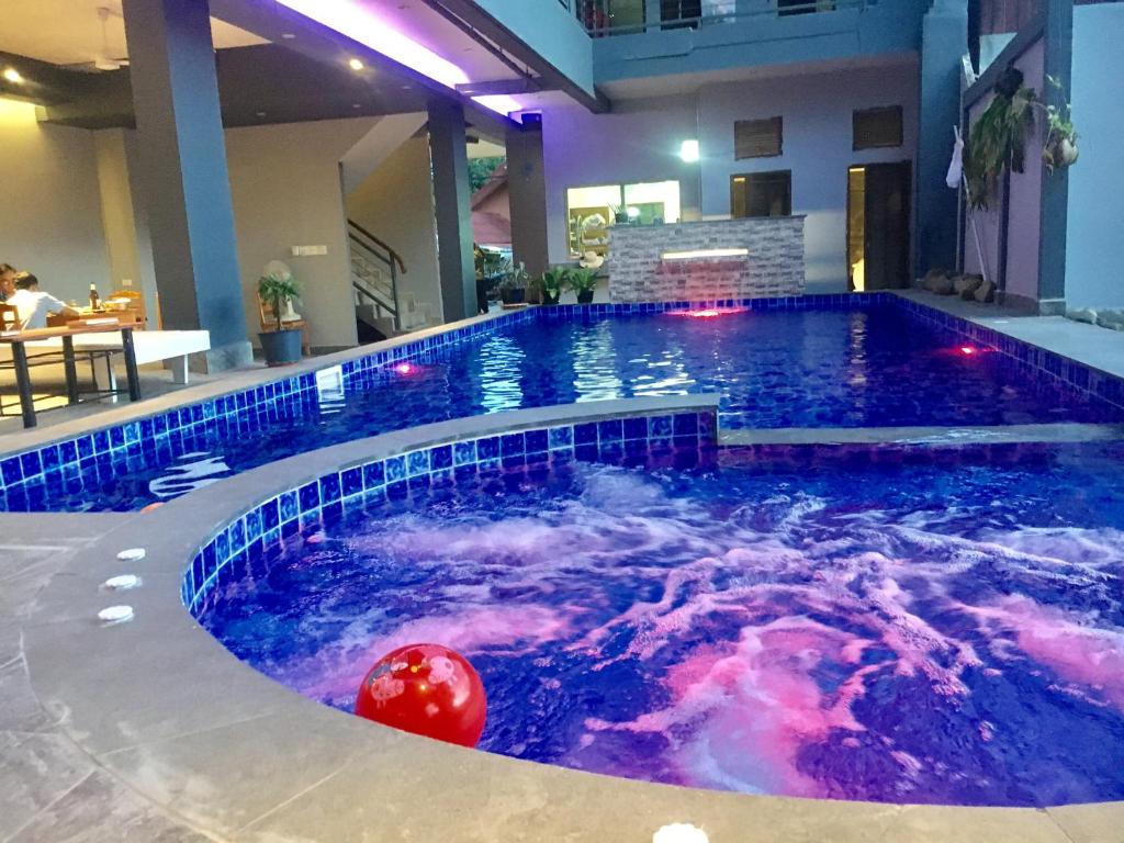 The swimming pool at or near FARAWAY SUITES