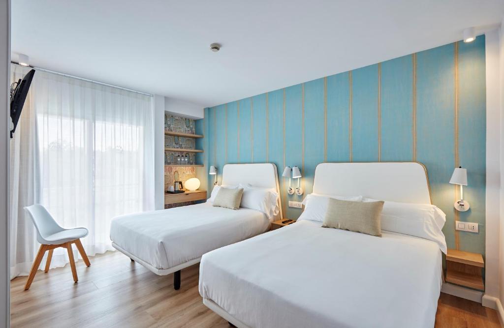 Postel nebo postele na pokoji v ubytování Hotel Anabel