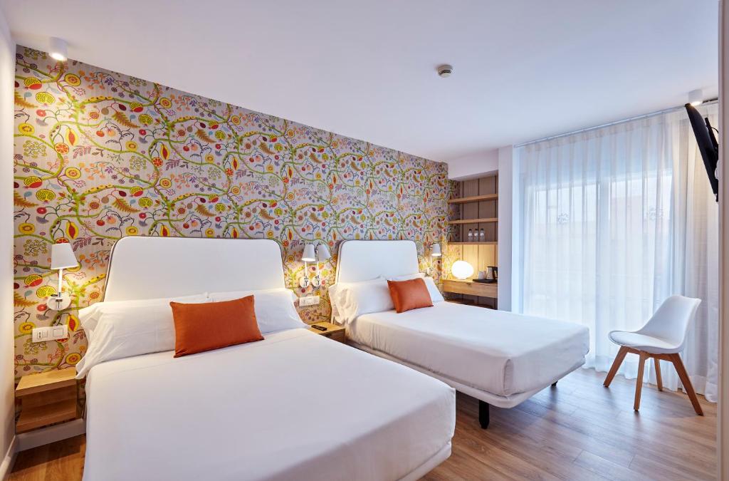 Postel nebo postele na pokoji v ubytování Hotel Anabel
