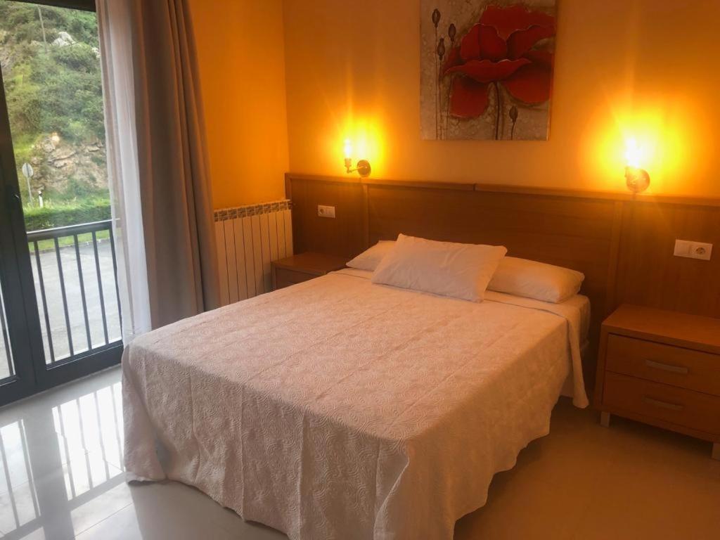 Postel nebo postele na pokoji v ubytování hotel la Ribera