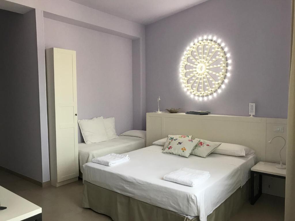 Posteľ alebo postele v izbe v ubytovaní Luci del Salento Guest House