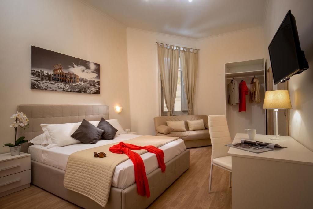 Un dormitorio con una cama con una cinta roja. en Domus Veneto Rome en Roma