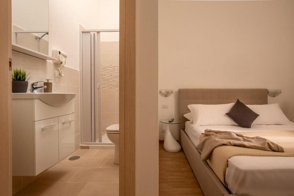 A bed or beds in a room at Domus Veneto Rome