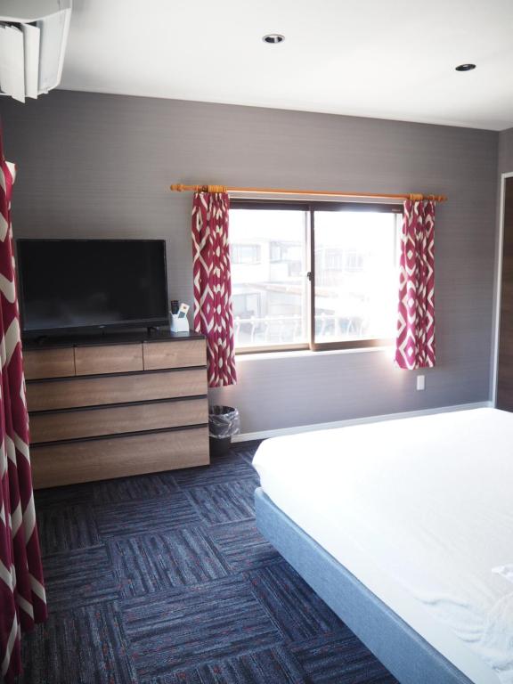 GUEST HOUSE BOSTONSにあるベッド