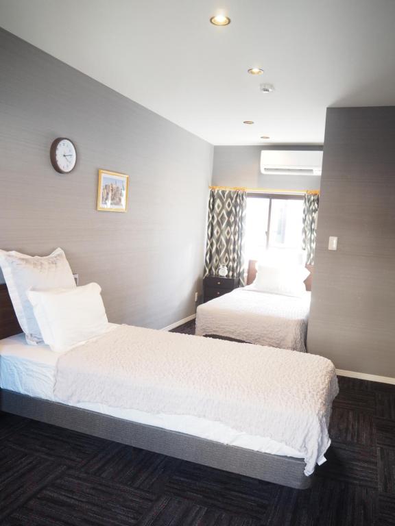 GUEST HOUSE BOSTONSにあるベッド