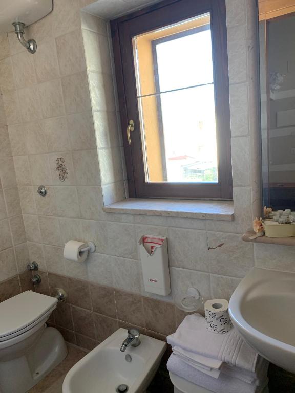 Koupelna v ubytování Albergo Ristorante del Cacciatore