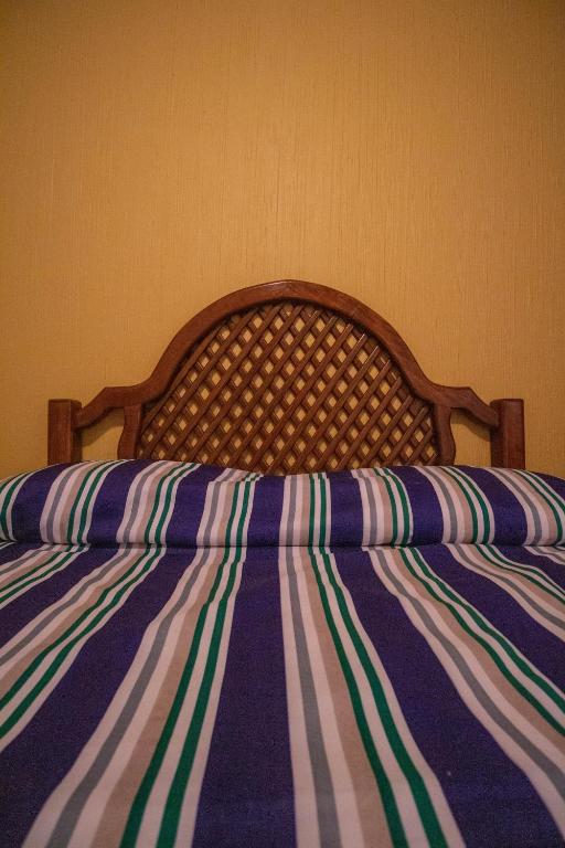 Postel nebo postele na pokoji v ubytování Hotel Degollado