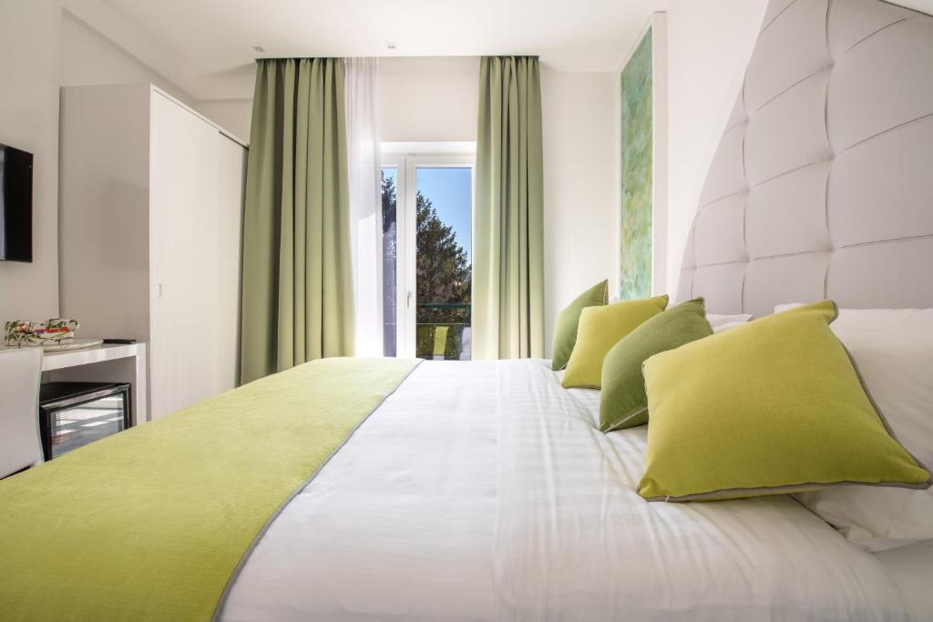 Postel nebo postele na pokoji v ubytování DIAMOND SUITE