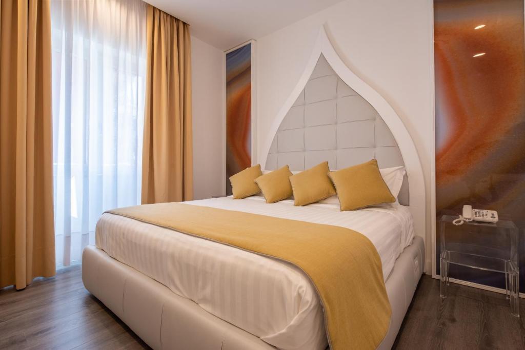 Postel nebo postele na pokoji v ubytování DIAMOND SUITE