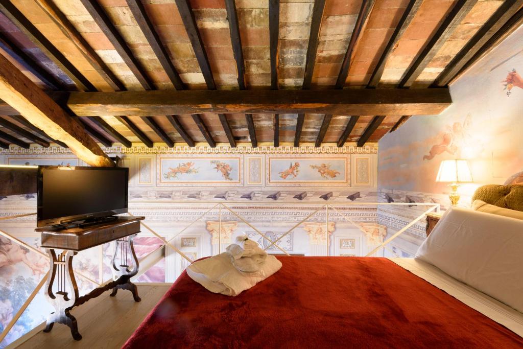 A bed or beds in a room at Domus Nannini SPA - Palazzo Nannini