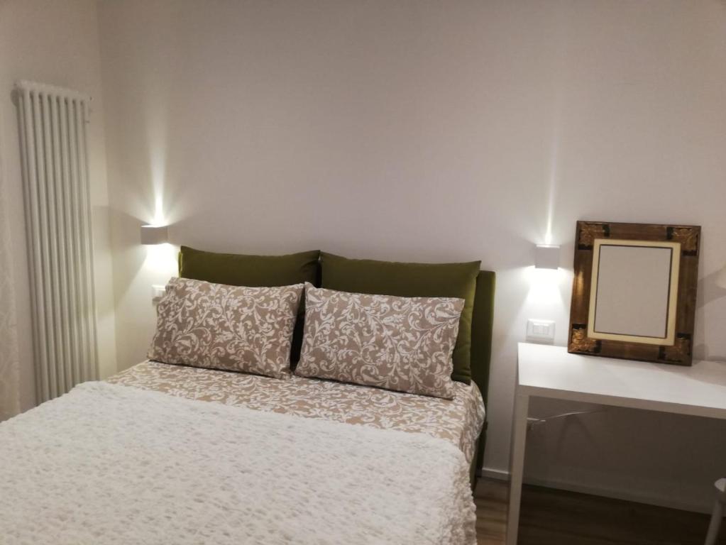 Postel nebo postele na pokoji v ubytování River Inn Arco