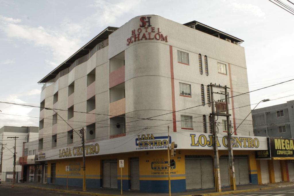 a large building on the corner of a street at Schalom Hotel in Imperatriz
