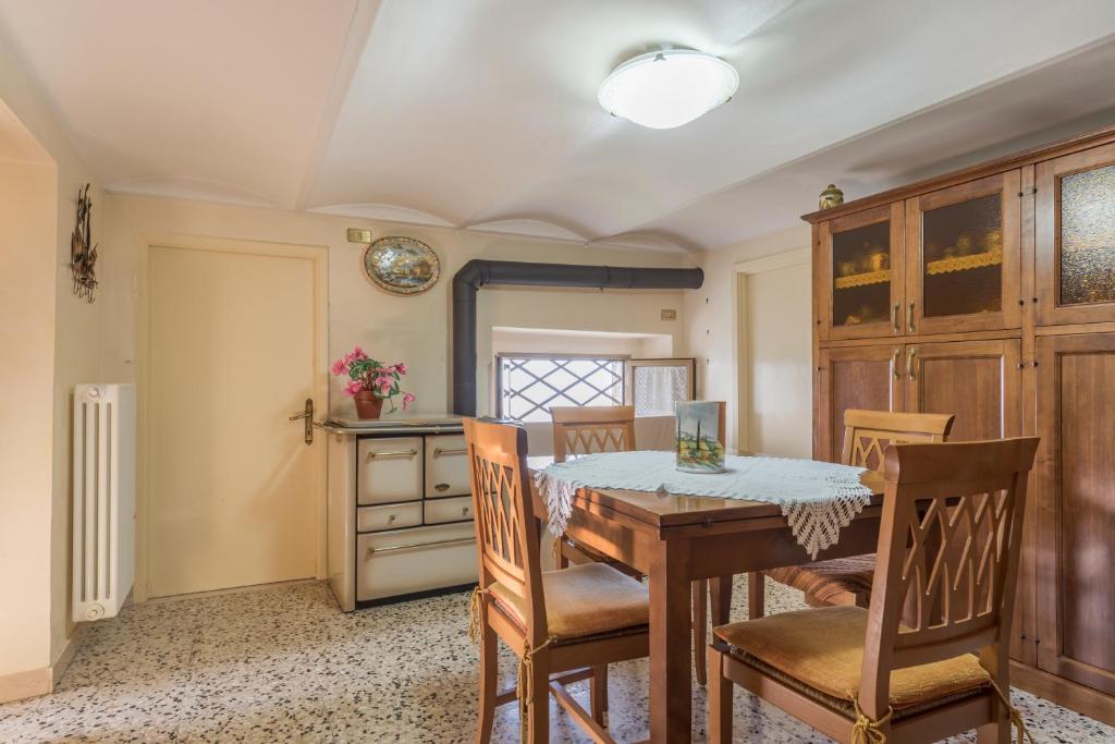 a dining room with a table and chairs at SOTTO LA PORTA BOREA in Citta' Sant'Angelo