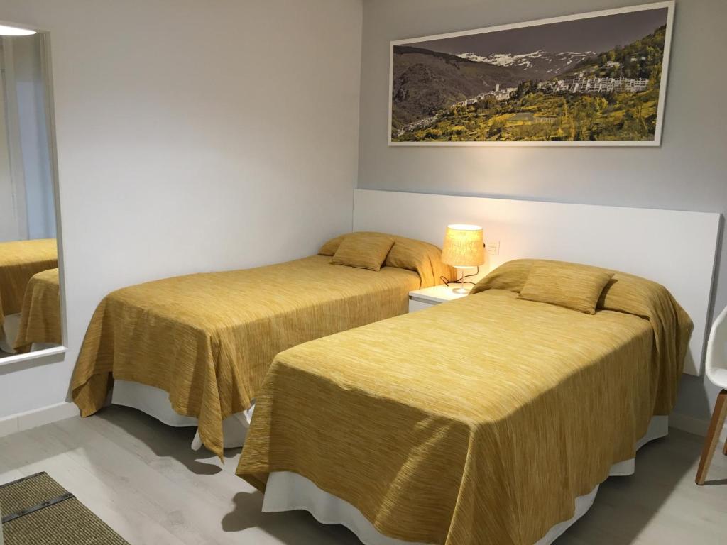 A bed or beds in a room at CARRERA HOME