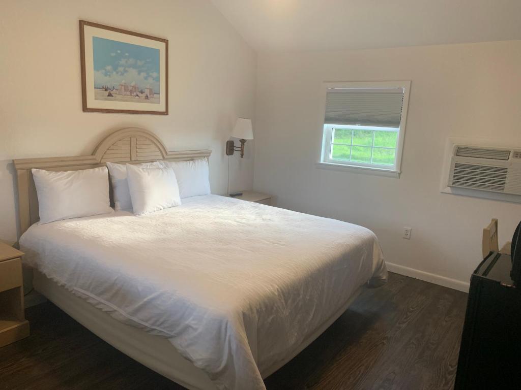 Postel nebo postele na pokoji v ubytování Cape Motel
