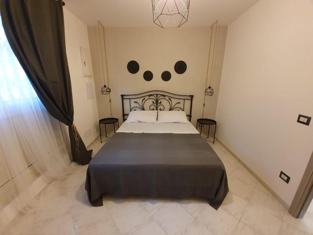 Postel nebo postele na pokoji v ubytování B&B città del carrubo
