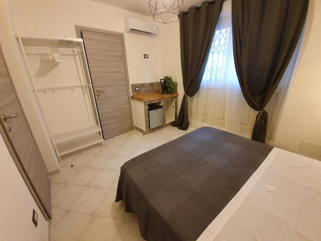 Postel nebo postele na pokoji v ubytování B&B città del carrubo