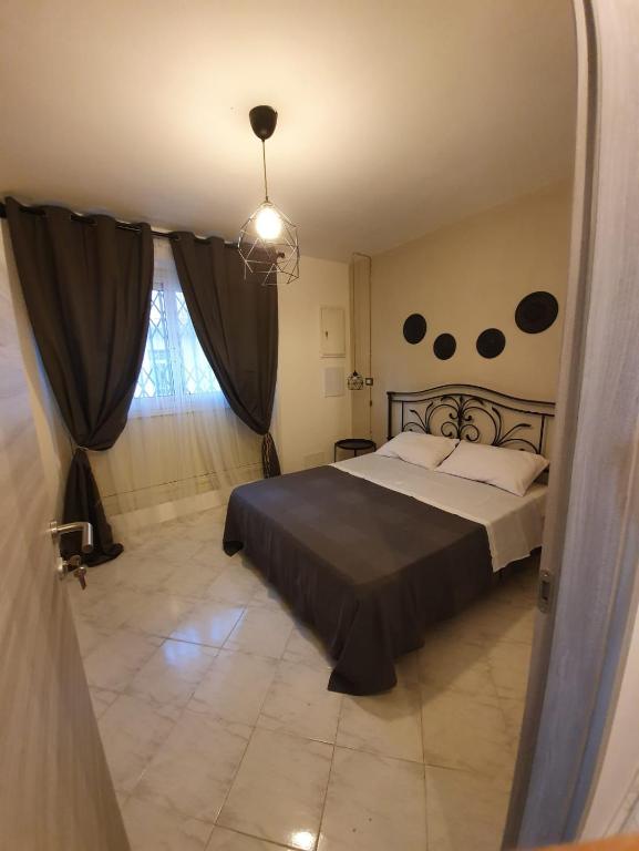 Postel nebo postele na pokoji v ubytování B&B città del carrubo