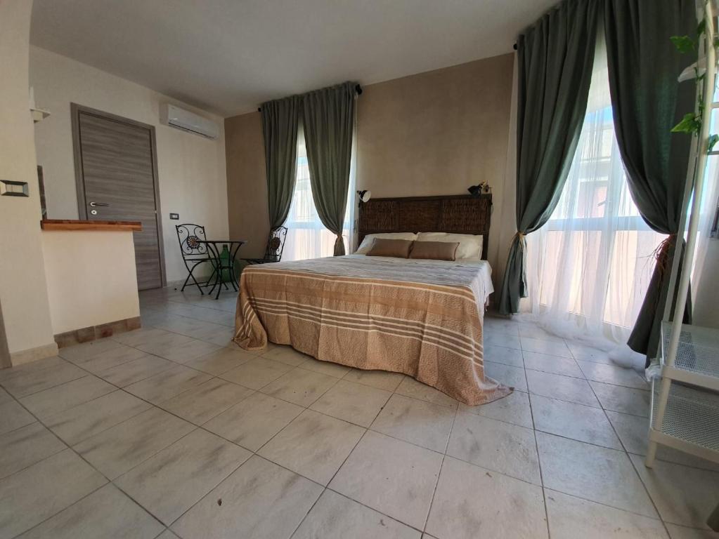 Postel nebo postele na pokoji v ubytování B&B città del carrubo