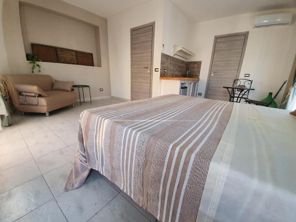 Postel nebo postele na pokoji v ubytování B&B città del carrubo