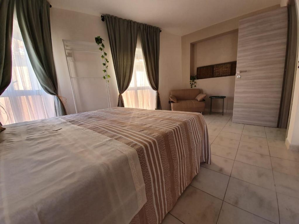 Postel nebo postele na pokoji v ubytování B&B città del carrubo