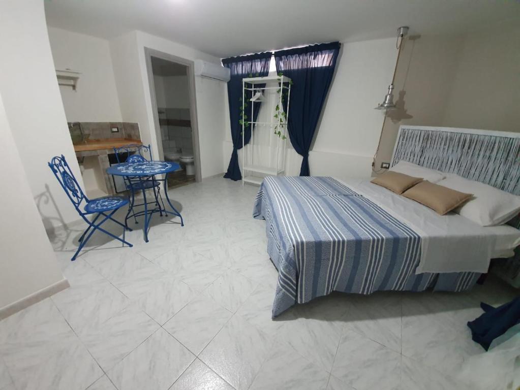 Postel nebo postele na pokoji v ubytování B&B città del carrubo