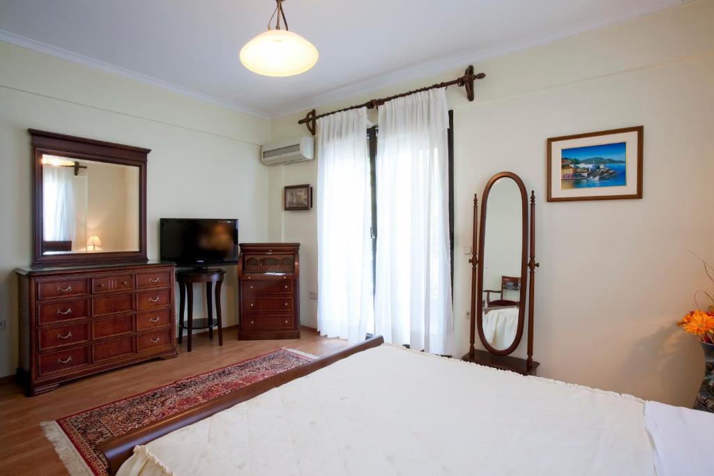Postel nebo postele na pokoji v ubytování Kymata Hotel