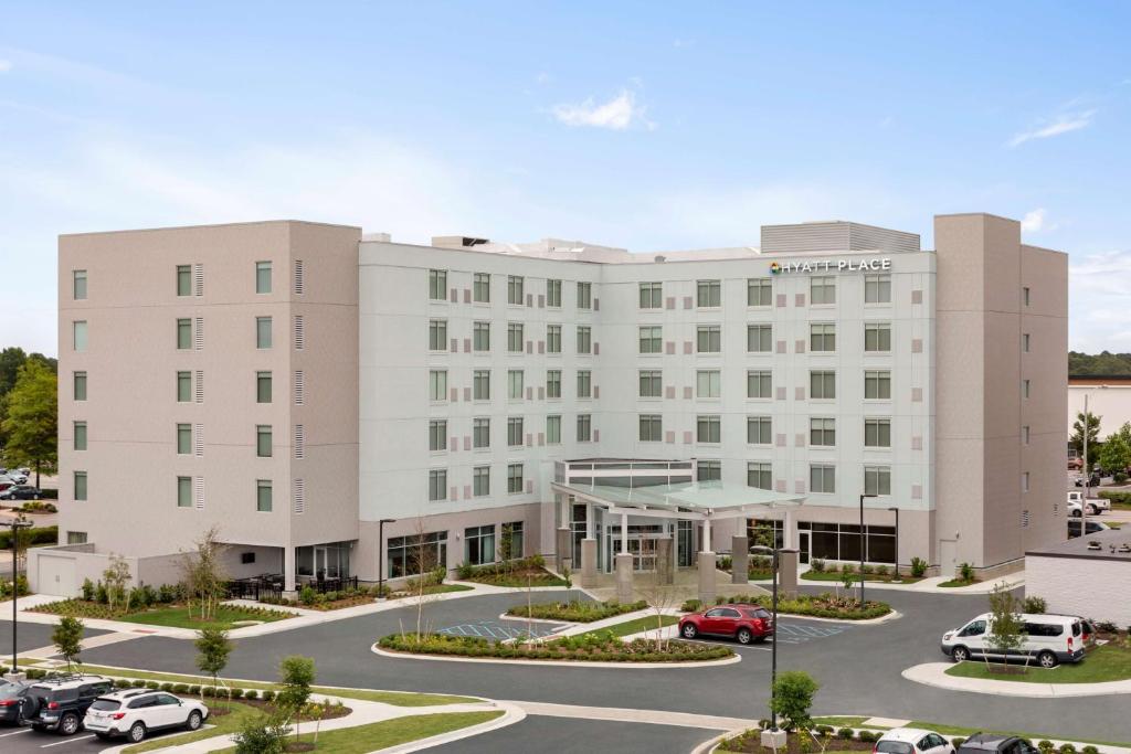 a large building with a lot of windows at Hyatt Place Virginia Beach Town Center in Virginia Beach