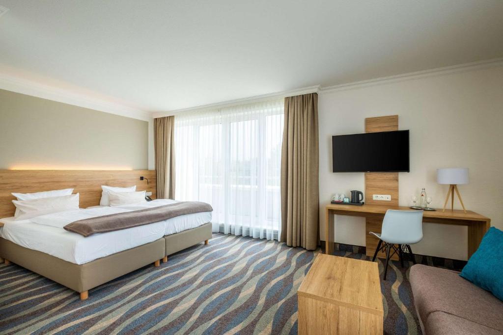Postel nebo postele na pokoji v ubytování Quality Hotel Lippstadt