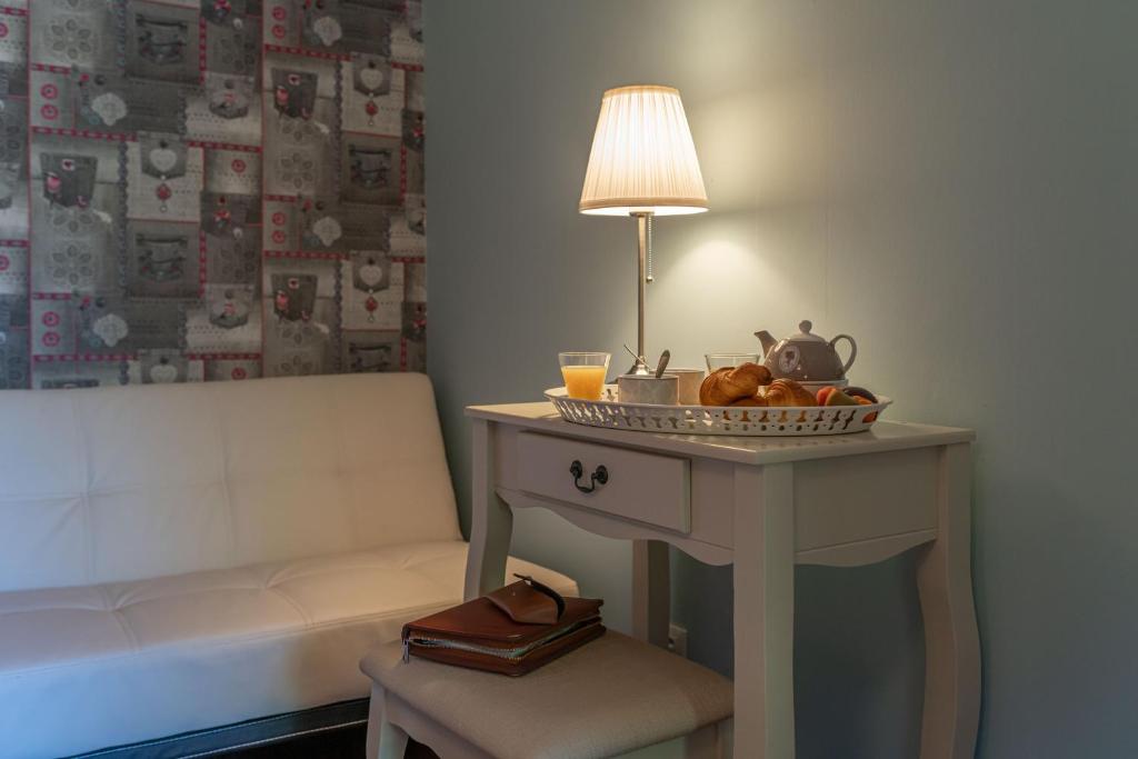 Posezení v ubytování Hôtel Au Coq Dort Spa