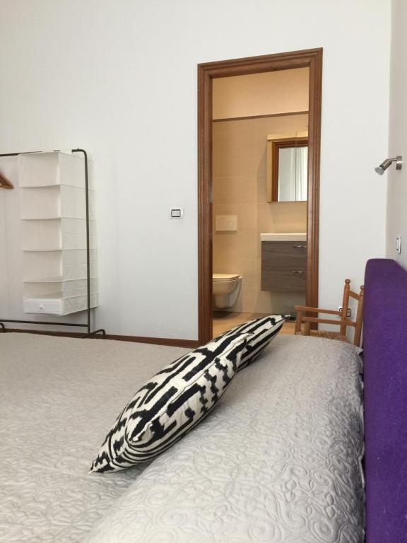 Posteľ alebo postele v izbe v ubytovaní Uma Apartments
